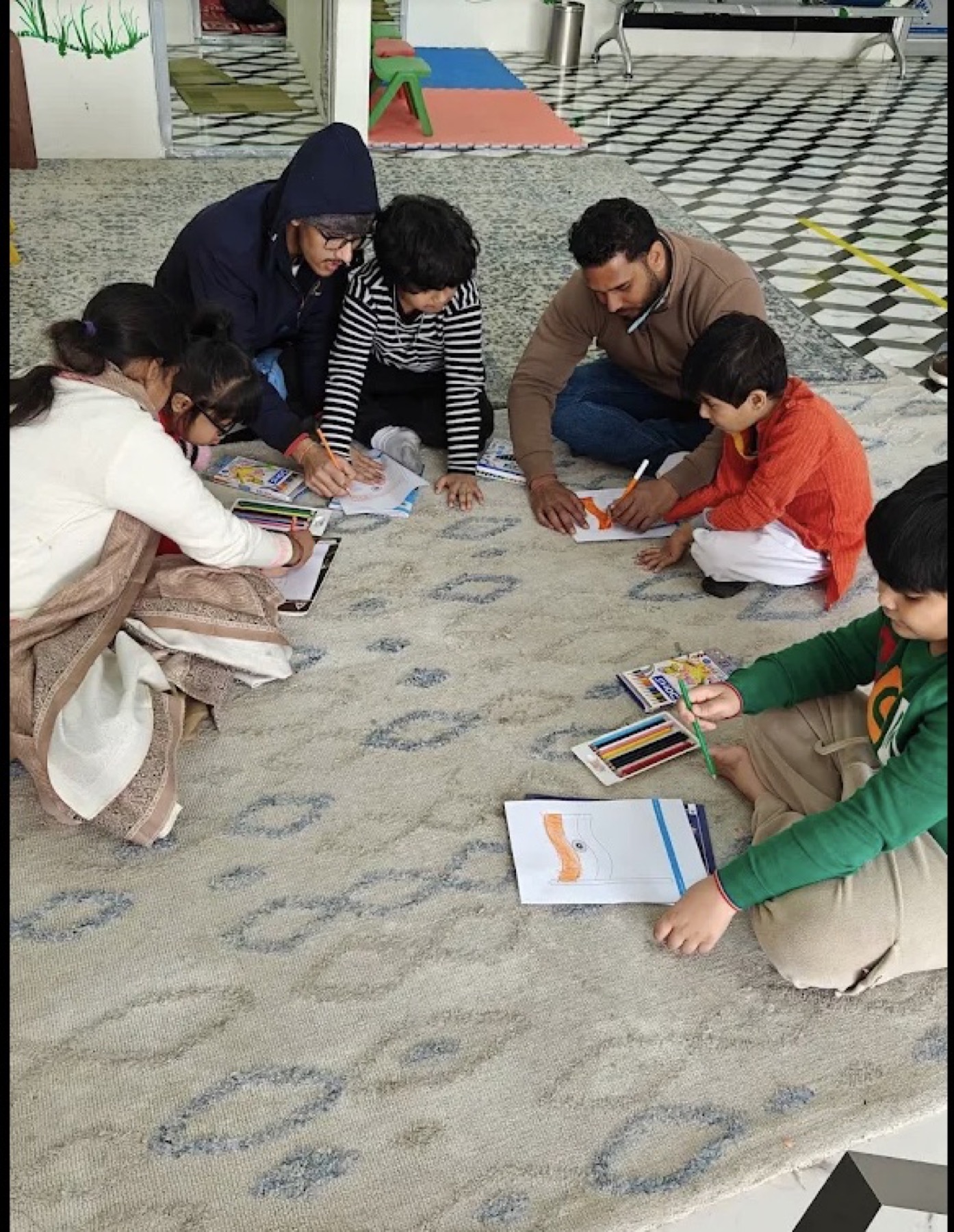Group drawing activity with therapists